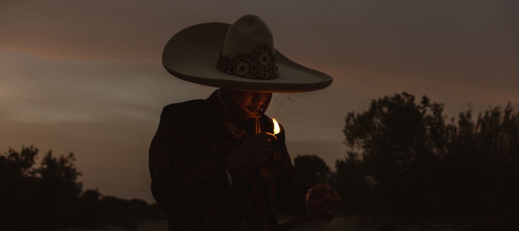 Exploring Visual Narratives - Man in sombrero lighting fire