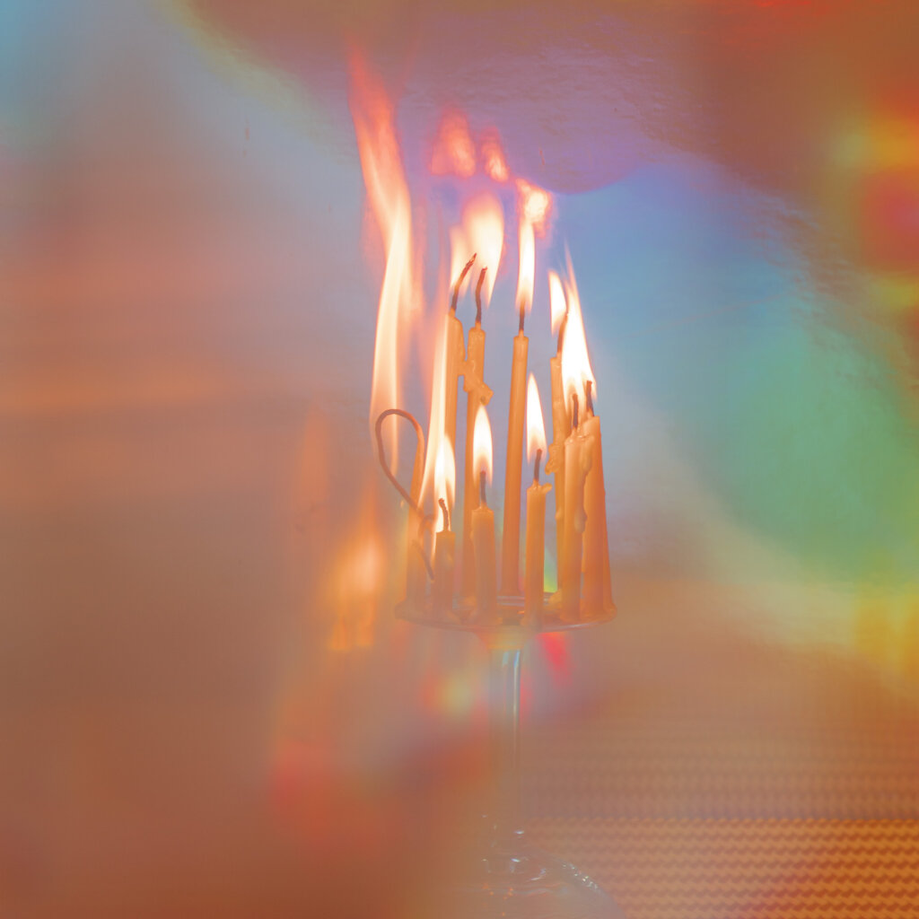 Smoke Surrounds Candles Burning On Top Of A Chandelier